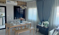 Gray pleated curtains in the dining room