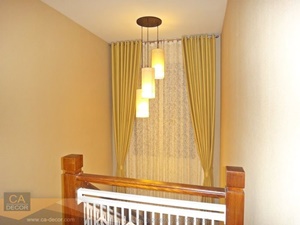 Yellow curtains, eyelets, hall stairs